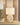 Beige tafellamp met ovale keramische voet en witte stoffen kap, moderne interieurverlichting.