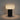 Moderne zwarte tafellamp met geribbelde witte kap, sfeerverlichting, minimalistisch design.
