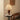 Klassieke houten tafellamp met beige stoffen kap op bijzettafel in moderne woonkamer.