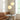 Twee ronde hanglampen, wit glas, moderne eetkamer, minimalistisch interieur, Scandinavisch design.