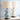 Twee keramische kalebas tafellampen, blauw en wit, op houten basis, moderne woondecoratie.
