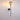 Zwarte wandlamp met glazen bol, modern design, sfeerverlichting, messing accenten.