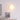 Wandlamp rond wit modern design, sfeerverlichting woonkamer, minimalistisch interieur.