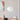 Witte hanglamp in moderne eetkamer, minimalistisch design, Scandinavische stijl, interieurdecoratie.